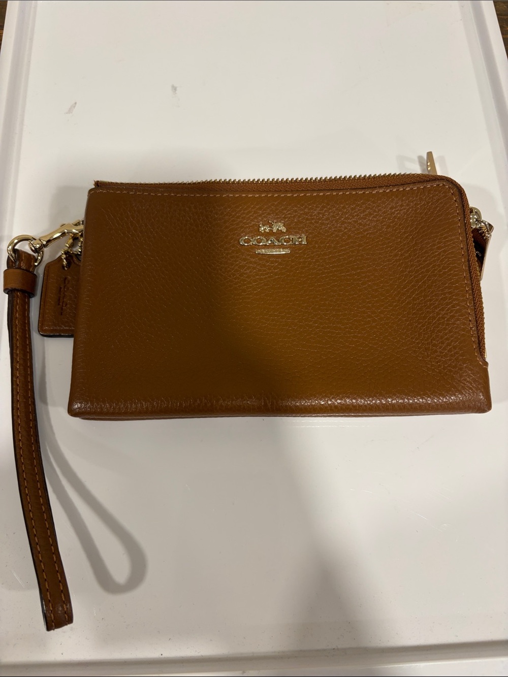 Coach Pebbled Leather Wristlet in Cognac Brown